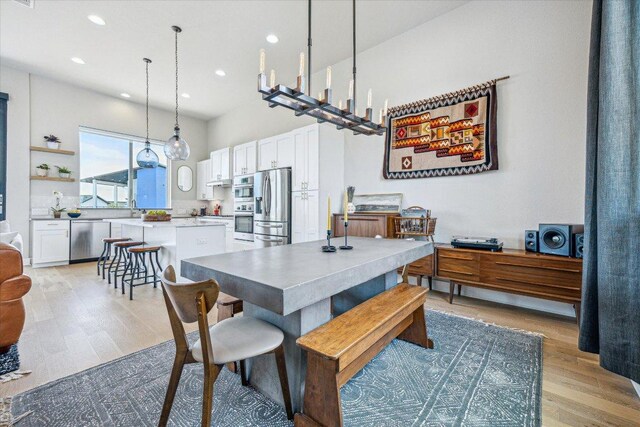 6229 Florencia Ln, Austin, TX 78724 - dining space with light wood-style flooring and recessed lighting