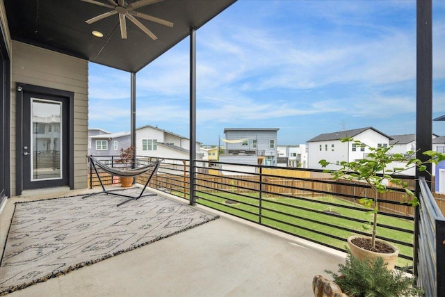 6229 Florencia Ln, Austin, TX 78724 - unfurnished sunroom featuring a ceiling fan and a residential view