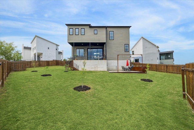 6229 Florencia Ln, Austin, TX 78724 - rear view of house featuring a fenced backyard and a fire pit