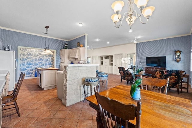 dining space with wallpapered walls, a chandelier, ornamental molding, and light tile patterned floors