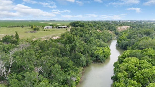 birds eye view of property with a water view and a rural view