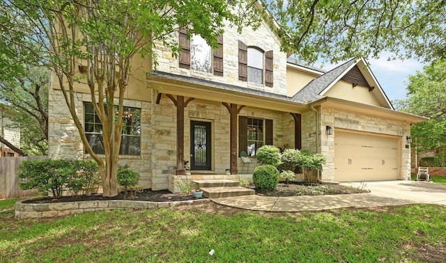 7716 Journeyville Dr, Austin, TX 78735 - view of front of home with stone siding, concrete driveway, a garage, and covered porch