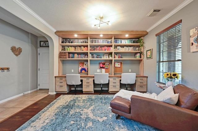 7716 Journeyville Dr, Austin, TX 78735 - office featuring built in desk, ornamental molding, dark wood finished floors, built in features, and arched walkways