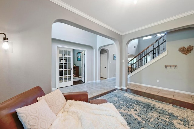 7716 Journeyville Dr, Austin, TX 78735 - tiled living area with arched walkways, crown molding, and stairs