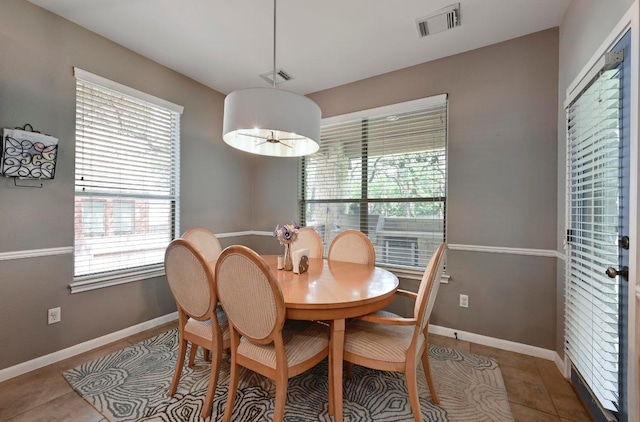 7716 Journeyville Dr, Austin, TX 78735 - dining room featuring baseboards and tile patterned floors