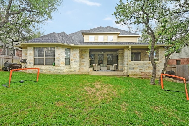 7716 Journeyville Dr, Austin, TX 78735 - back of house with stone siding, a shingled roof, and a patio area