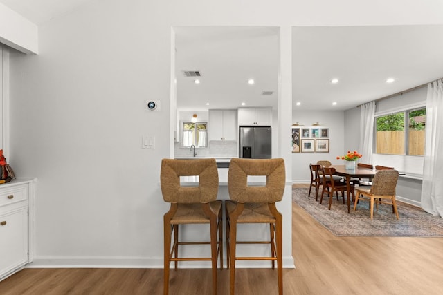 4302 Red Cloud Dr, Austin, TX 78759 - dining area with light wood finished floors, recessed lighting, and baseboards