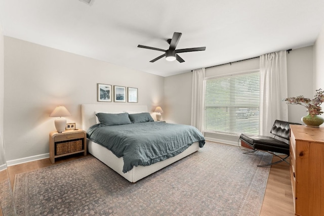 4302 Red Cloud Dr, Austin, TX 78759 - bedroom with baseboards, wood finished floors, and ceiling fan