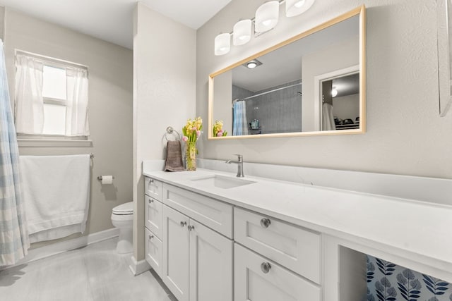 4302 Red Cloud Dr, Austin, TX 78759 - bathroom with vanity, toilet, a shower with curtain, and baseboards
