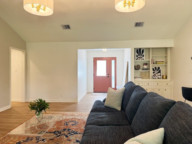 4302 Red Cloud Dr, Austin, TX 78759 - living room with light wood finished floors and lofted ceiling