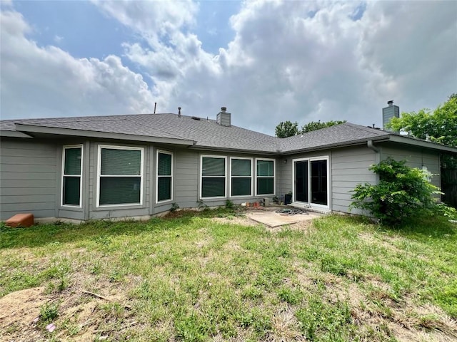 3622 Cheyenne St, Round Rock, TX 78664 - back of property featuring a chimney, a yard, a patio area, and roof with shingles