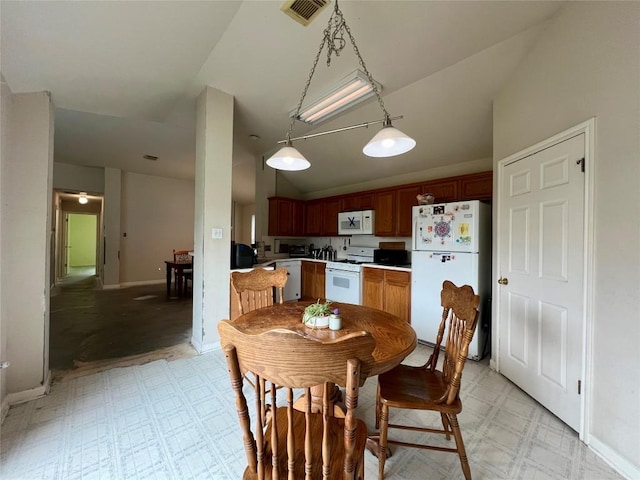 3622 Cheyenne St, Round Rock, TX 78664 - dining area with lofted ceiling, light flooring, and baseboards