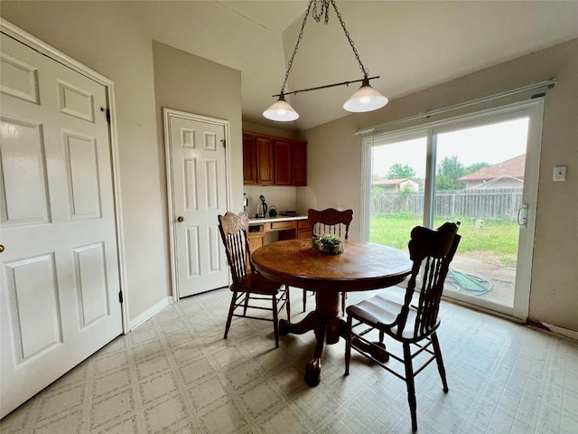 3622 Cheyenne St, Round Rock, TX 78664 - dining room featuring baseboards, vaulted ceiling, and light floors