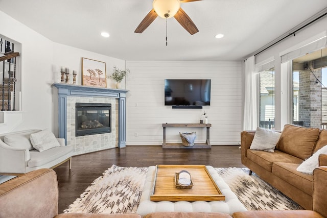 5609 Traviston Ct, Austin, TX 78738 - living room featuring ceiling fan, a tiled fireplace, wood finished floors, and recessed lighting
