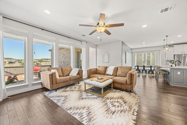 5609 Traviston Ct, Austin, TX 78738 - living area featuring dark wood-type flooring, a ceiling fan, and recessed lighting
