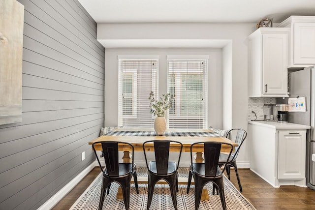 5609 Traviston Ct, Austin, TX 78738 - dining area featuring wood walls and dark wood-style floors