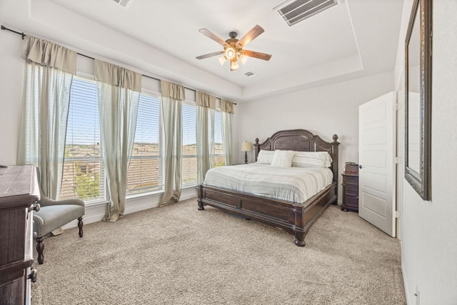5609 Traviston Ct, Austin, TX 78738 - bedroom featuring a tray ceiling, light carpet, and ceiling fan
