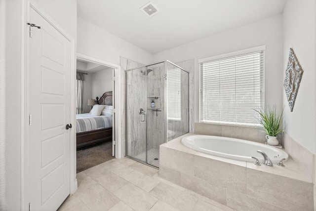 5609 Traviston Ct, Austin, TX 78738 - full bathroom with a garden tub, a stall shower, ensuite bath, and tile patterned flooring