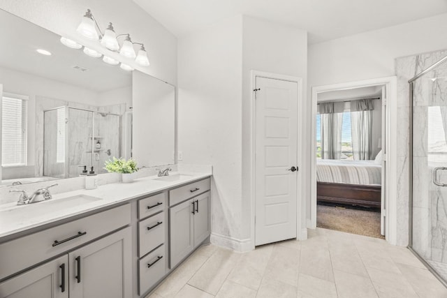 5609 Traviston Ct, Austin, TX 78738 - ensuite bathroom with a marble finish shower, double vanity, and tile patterned floors