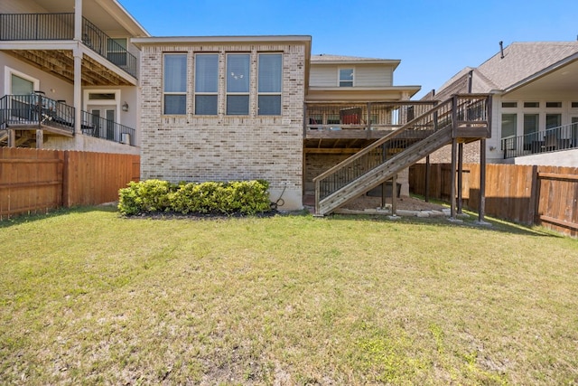 5609 Traviston Ct, Austin, TX 78738 - rear view of house with brick siding, a fenced backyard, stairs, and a wooden deck