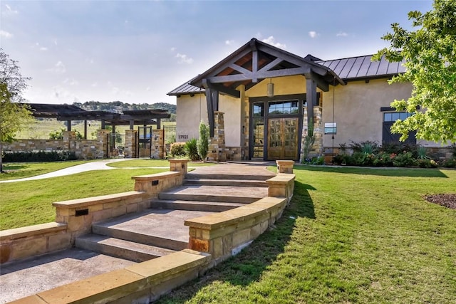 5609 Traviston Ct, Austin, TX 78738 - view of front of home featuring a standing seam roof, french doors, stucco siding, and a metal roof