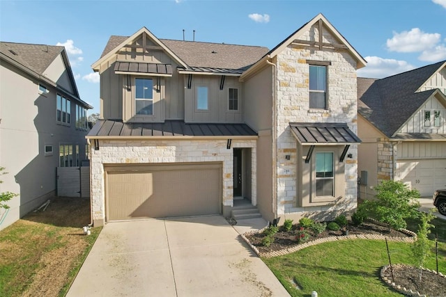 244 Diamondback Dr, Georgetown, TX 78628 - view of front of house with stone siding, a standing seam roof, a garage, concrete driveway, and board and batten siding