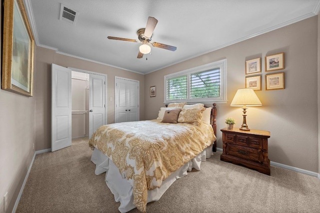 4101 Galacia Dr, Austin, TX 78759 - bedroom with light colored carpet, two closets, crown molding, and ceiling fan