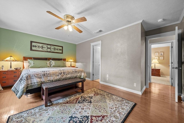 4101 Galacia Dr, Austin, TX 78759 - bedroom featuring wood finished floors, ornamental molding, and a ceiling fan
