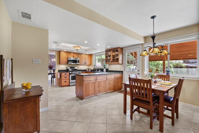 4101 Galacia Dr, Austin, TX 78759 - dining room with a tray ceiling, light tile patterned floors, recessed lighting, and a chandelier