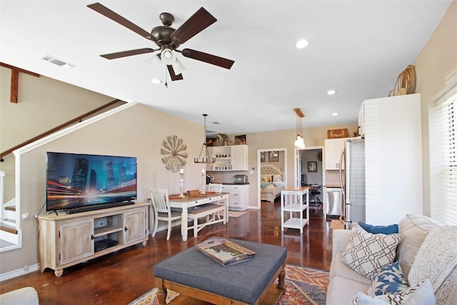 living room featuring recessed lighting, visible vents, a ceiling fan, and baseboards