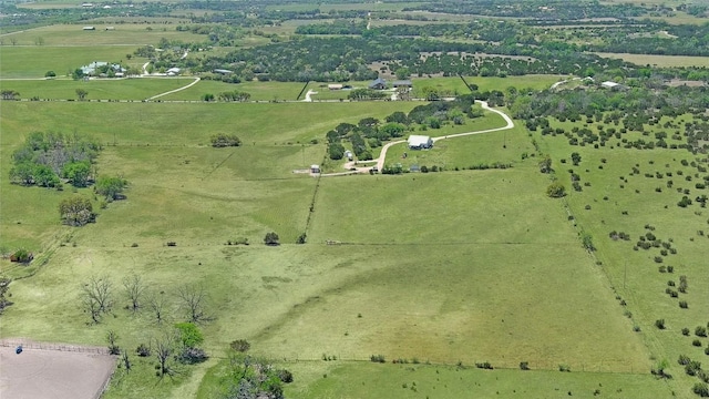 birds eye view of property with a rural view