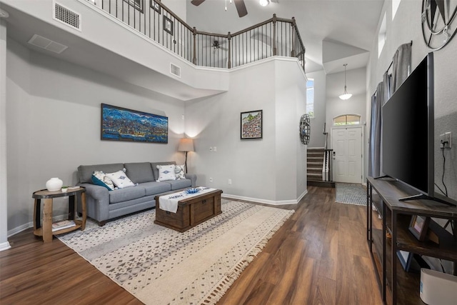 1404 Jenkins Bnd Unit 11, Austin, TX 78748 - living area featuring a towering ceiling, dark wood-style floors, and ceiling fan