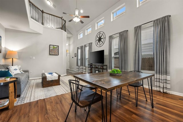 1404 Jenkins Bnd Unit 11, Austin, TX 78748 - dining room with a towering ceiling, wood finished floors, a ceiling fan, and healthy amount of natural light