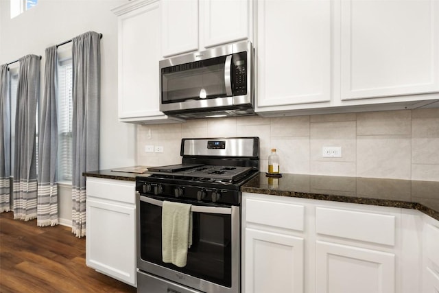 1404 Jenkins Bnd Unit 11, Austin, TX 78748 - kitchen with appliances with stainless steel finishes, tasteful backsplash, and white cabinetry