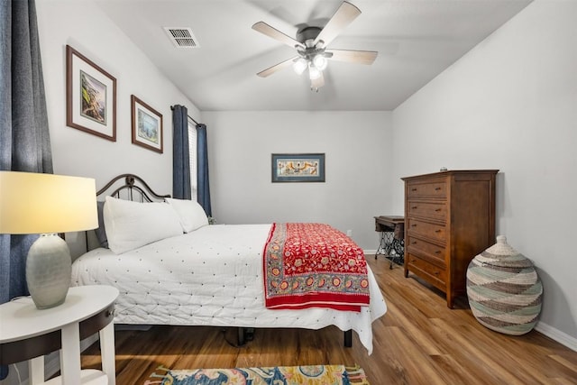 1404 Jenkins Bnd Unit 11, Austin, TX 78748 - bedroom featuring wood finished floors and a ceiling fan
