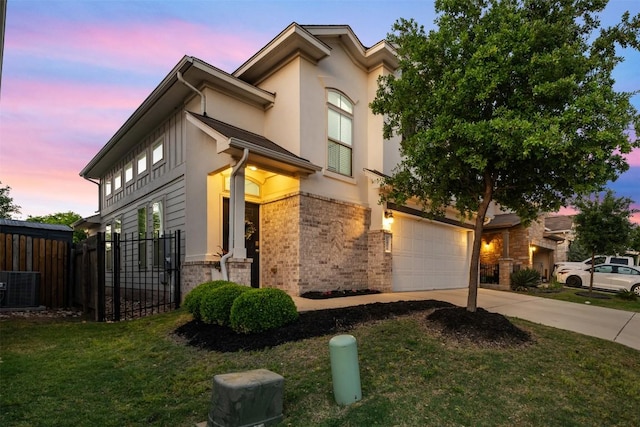1404 Jenkins Bnd Unit 11, Austin, TX 78748 - view of front of house featuring driveway, stucco siding, and an attached garage