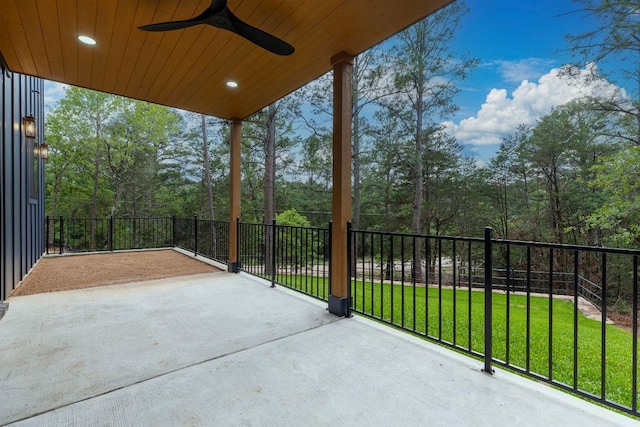view of patio / terrace with driveway and ceiling fan