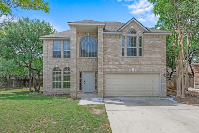 104 Summerwood Cv, San Marcos, TX 78666 - view of front of house featuring driveway, an attached garage, brick siding, and roof with shingles