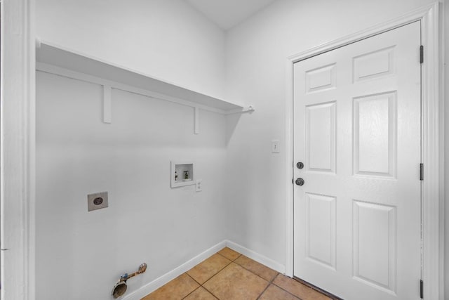 104 Summerwood Cv, San Marcos, TX 78666 - laundry room featuring washer hookup, light tile patterned flooring, baseboards, gas dryer hookup, and electric dryer hookup