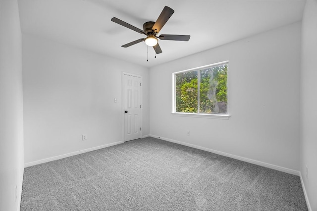 104 Summerwood Cv, San Marcos, TX 78666 - carpeted spare room featuring baseboards and a ceiling fan