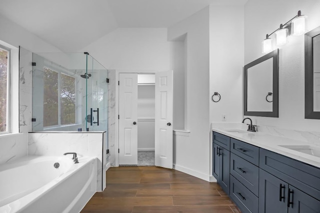 104 Summerwood Cv, San Marcos, TX 78666 - bathroom with a marble finish shower, a garden tub, plenty of natural light, double vanity, and vaulted ceiling