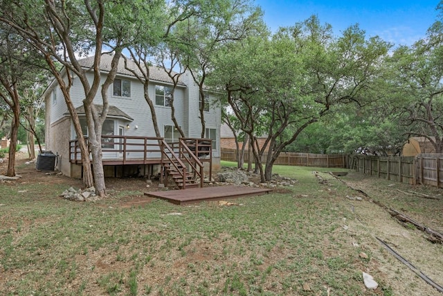 104 Summerwood Cv, San Marcos, TX 78666 - view of yard featuring a wooden deck and central AC unit