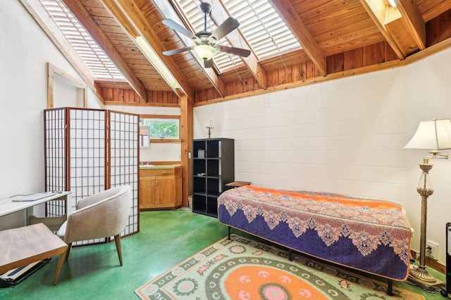 bedroom with wood ceiling, carpet floors, and lofted ceiling with skylight