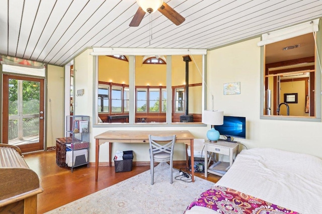 bedroom featuring wood ceiling, wood finished floors, visible vents, and access to outside
