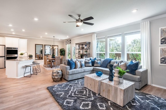 1100 Cole Estates Dr, Georgetown, TX 78628 - living room featuring plenty of natural light, recessed lighting, and ornamental molding