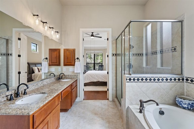 2328 Gilia Dr, Austin, TX 78733 - full bathroom with ensuite bath, a garden tub, ceiling fan, and double vanity