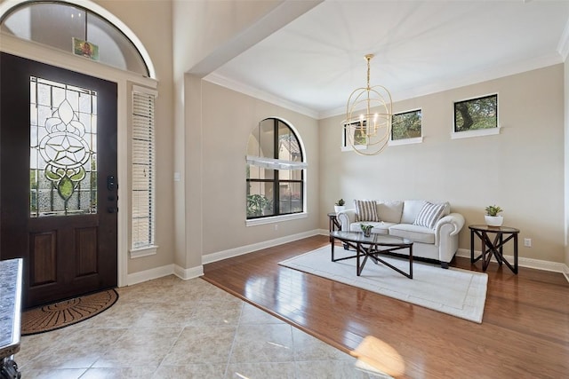 2328 Gilia Dr, Austin, TX 78733 - foyer entrance featuring a chandelier, crown molding, and wood finished floors