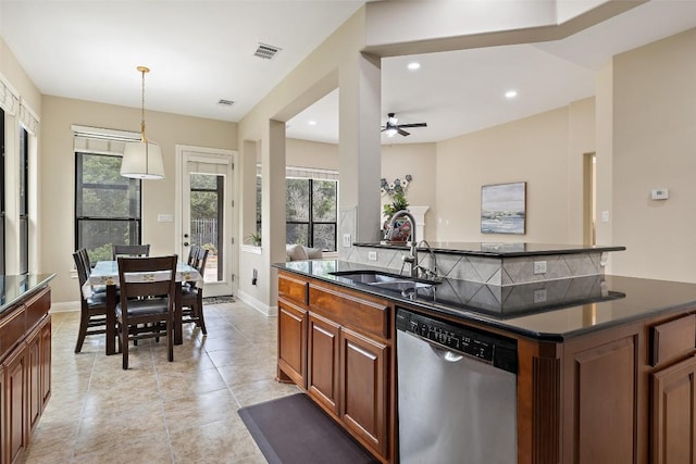 2328 Gilia Dr, Austin, TX 78733 - kitchen featuring dishwasher, a ceiling fan, pendant lighting, a center island with sink, and light tile patterned floors