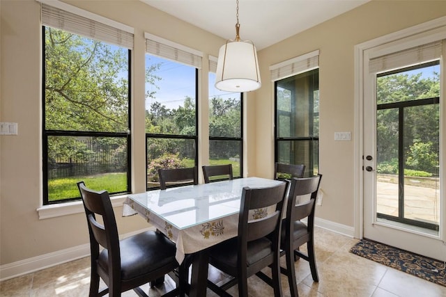 2328 Gilia Dr, Austin, TX 78733 - dining room featuring baseboards and light tile patterned floors