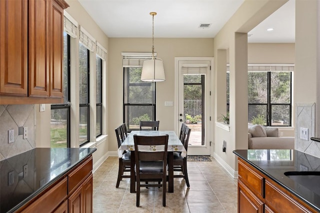 2328 Gilia Dr, Austin, TX 78733 - dining space featuring light tile patterned floors and baseboards